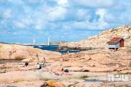 Sunbathing people on rocks by the sea, Stock Photo, Picture ...