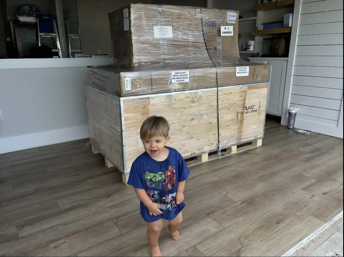 Pallet in garage with son.PNG