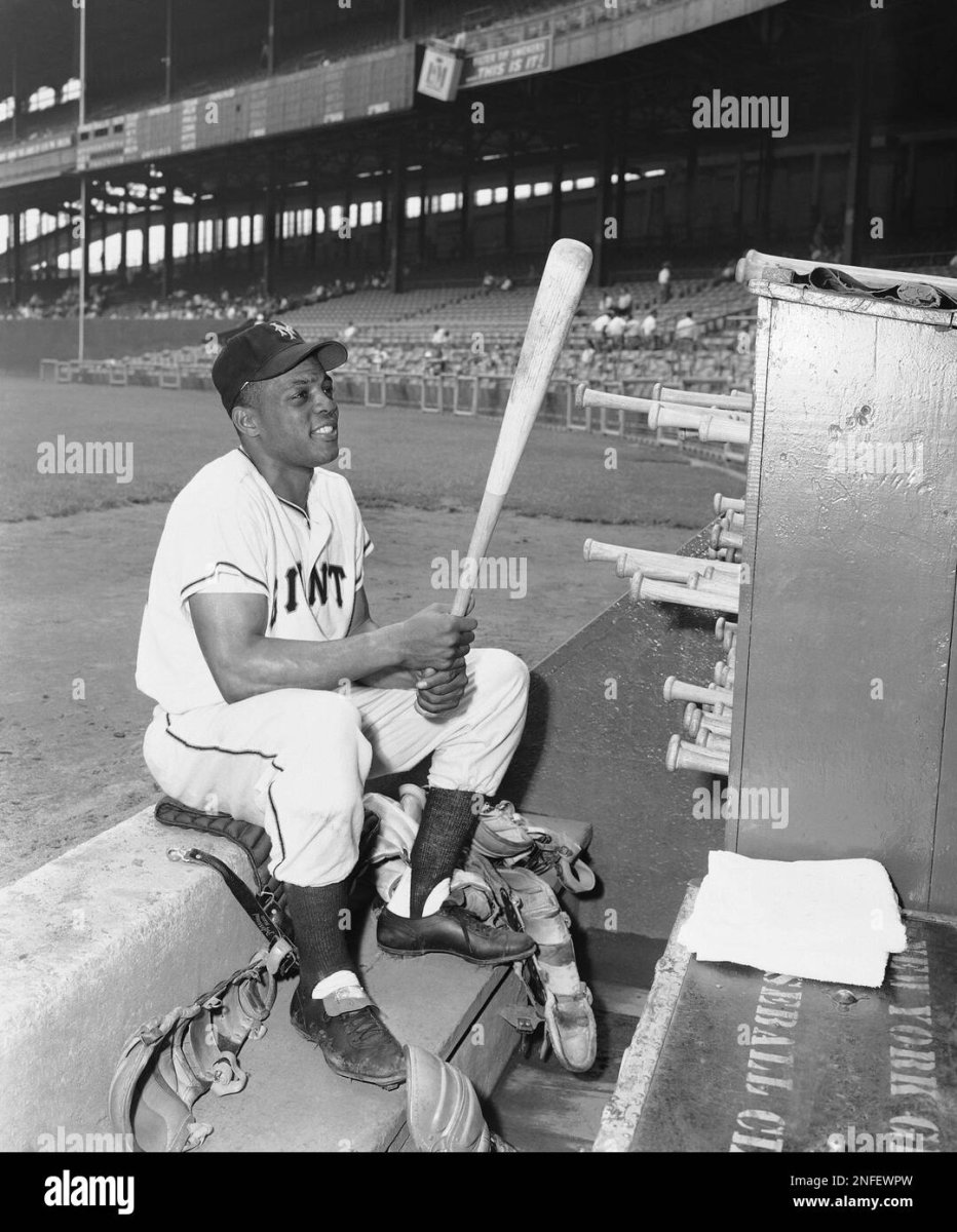 willie-mays-new-york-giants-star-centerfielder-examines-one-of-his-favorite-bats-as-he-sits-on...jpg